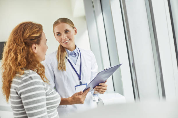 Practitioner talking to patient after WOW Intimate Sensitivity PRP procedure