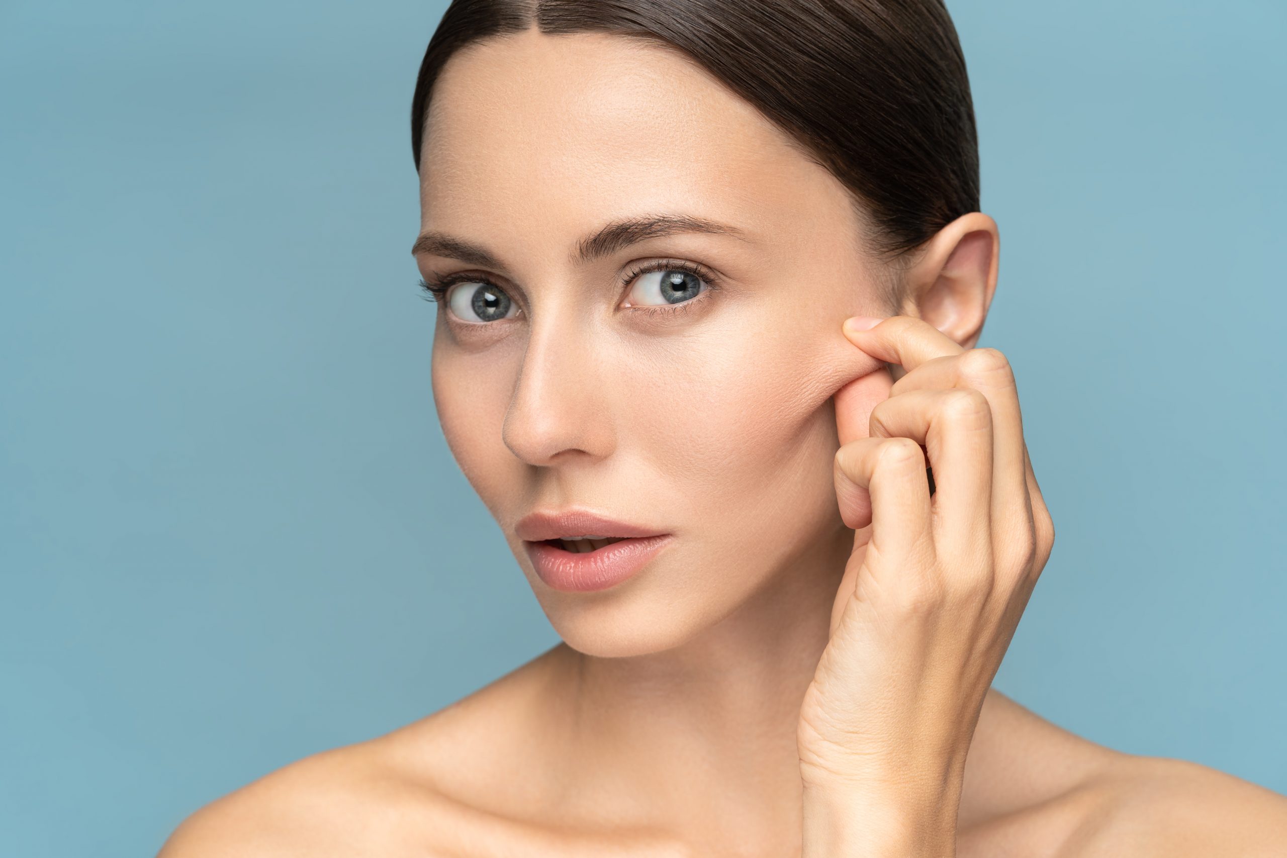 Woman,Without,Makeup,Touching,Cheeks,After,Glycolic,Acid,Peel,,Has skin-tightening