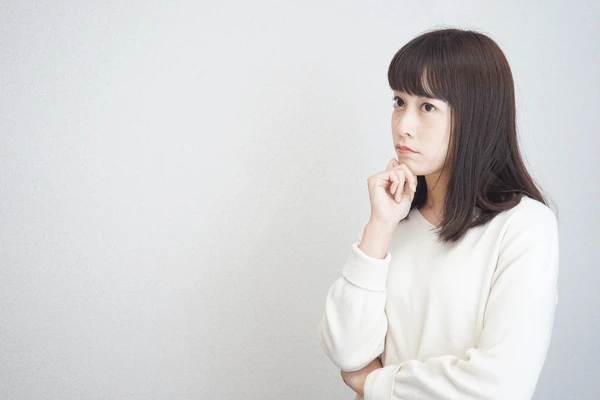 Young woman considering if she is a good candidate for Restylane Contour injection for enhanced cheek and facial contouring