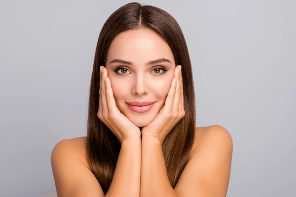 A woman enjoying radiant and rejuvenated skin after Laser GenesisV treatment