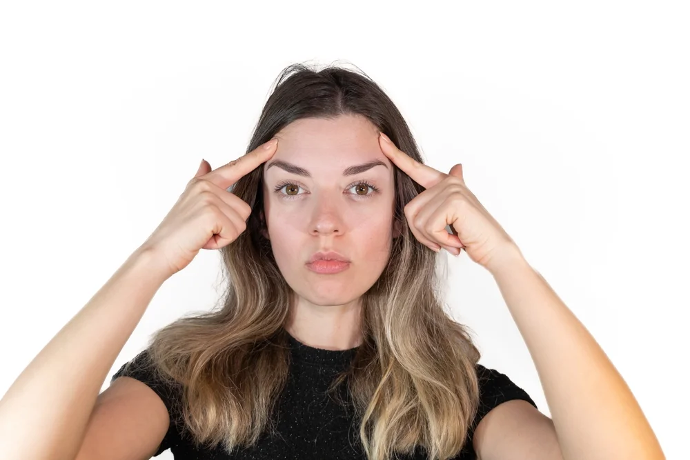 Woman considering if she is a candidate for Morpheus8V vaginal rejuvenation treatment, evaluating her suitability for the non-surgical procedure.