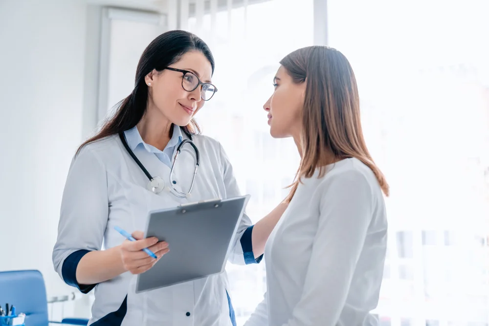 Doctor consulting a patient before FormaV treatment, discussing non-surgical vaginal rejuvenation options and health benefits.