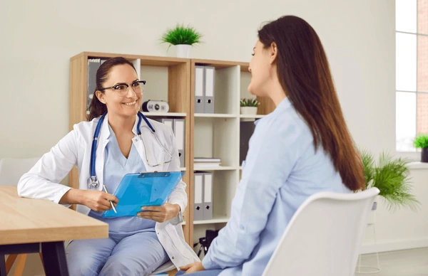 Doctor consulting with patient before Restylane Contour injection, discussing preparation steps for optimal cheek enhancement