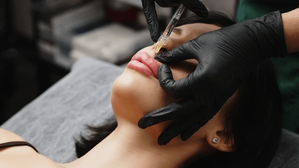 Restylane Silk injection showcasing benefits like natural lip enhancement, improved shape, and smoother lip texture