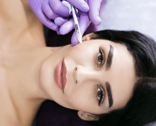 Benefits of Sculptra face filler, rejuvenating facial volume, reducing wrinkles, and restoring youthful appearance 