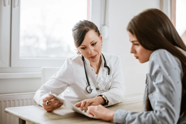 Patient consultation with a cosmetologist before undergoing Quantum RF InMode treatment.