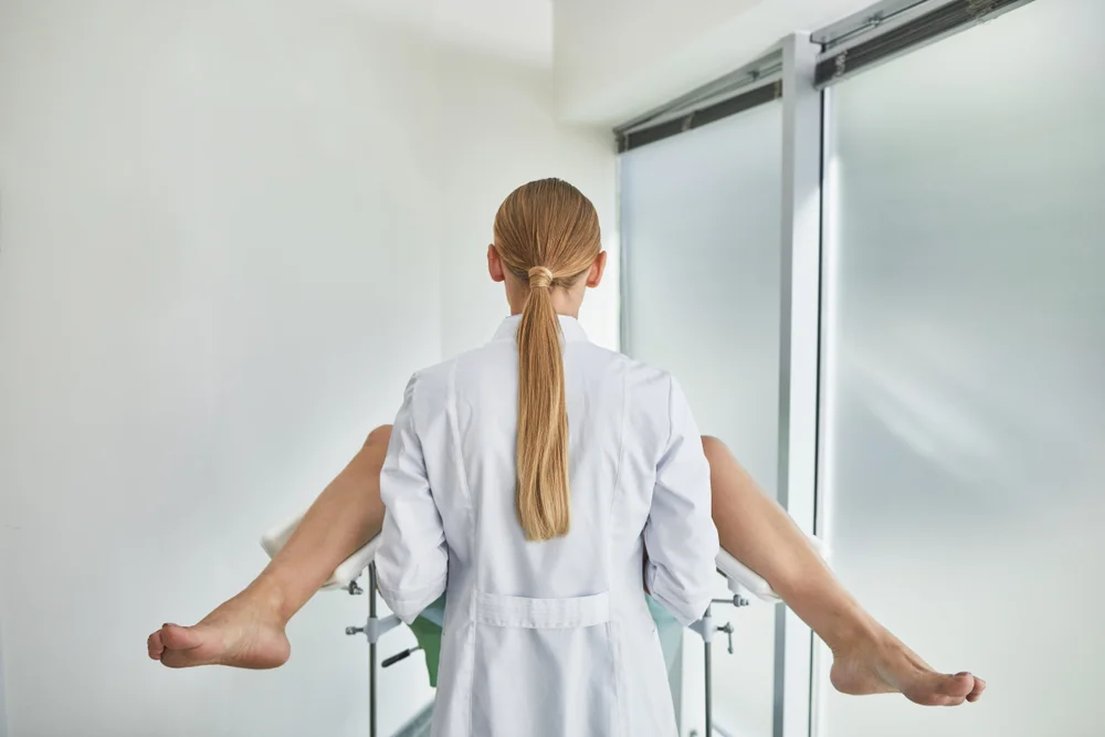 Doctor performing FormaV procedure, a non-surgical vaginal rejuvenation treatment, in a clinical setting to enhance vaginal tone and elasticity.