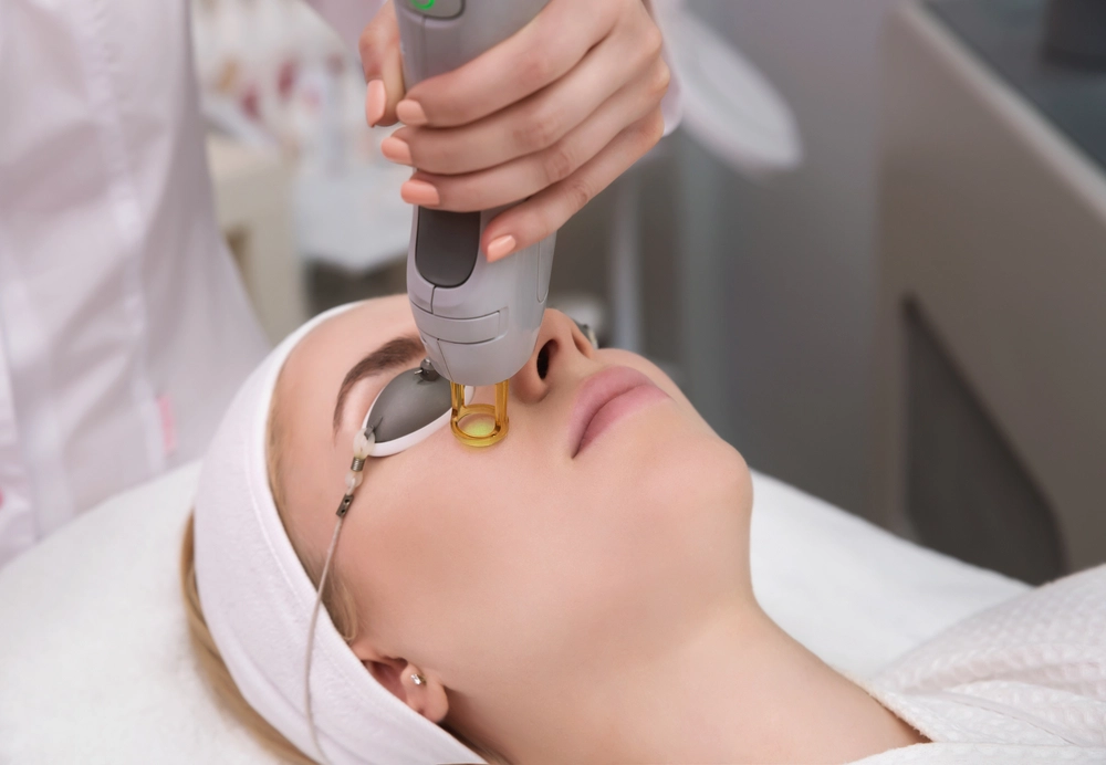 Patient undergoing Genesis V laser procedure for skin rejuvenation treatment.
