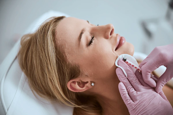 Restylane Defyne injection during procedure to enhance facial contours and reduce wrinkles