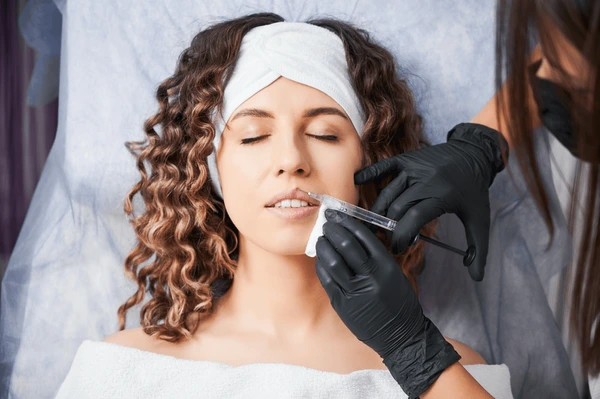 Patient receiving Restylane Silk procedure for natural lip enhancement