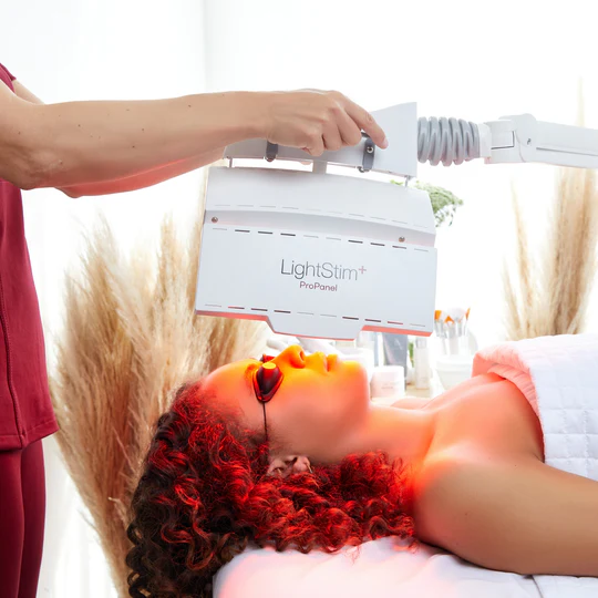 led-lightstim-therapy-explained-treatment-session A woman undergoing LED LightStim therapy treatment, a non-invasive skin rejuvenation method for improved skin health