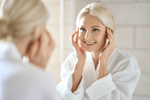 Woman enjoying smooth skin after Morpheus8 treatment, showing recovery and aftercare benefits for skin tightening