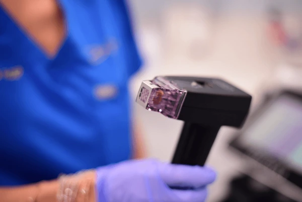 Morpheus8 RF device highlighting treatment benefits for skin tightening, wrinkle reduction, and improved skin texture