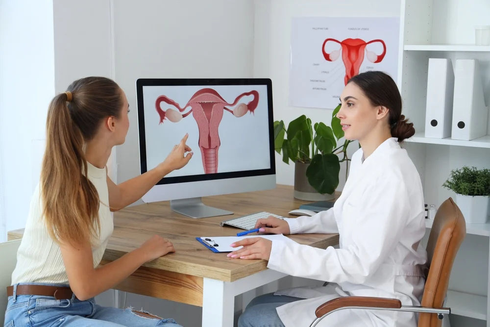 morpheus8v-treatment-vaginal-rejuvenation-consultation Doctor explaining Morpheus8V treatment to a patient, a non-surgical procedure using RF technology for vaginal rejuvenation and improved health.