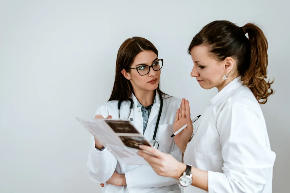 Doctors discussing the potential side effects and risks of Morpheus8V treatment, ensuring informed decision-making for vaginal rejuvenation.