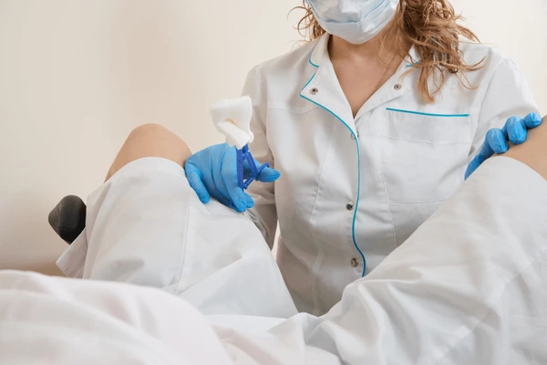 Medical professional performing a procedure related to TempSure Vitalia, showcasing alternatives for vaginal rejuvenation.