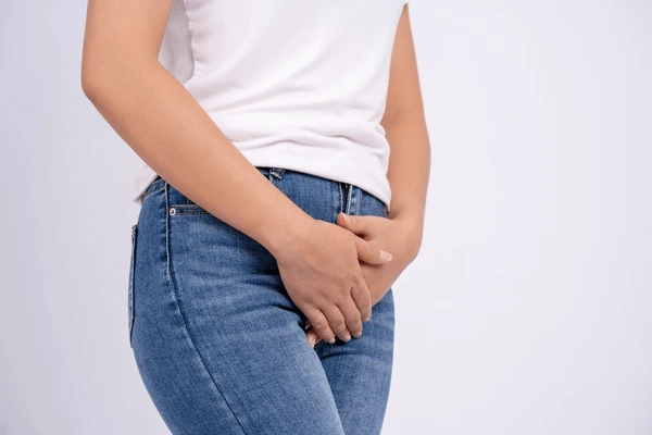 Woman experiencing discomfort, illustrating potential side effects and risks of TempSure Vitalia Treatment