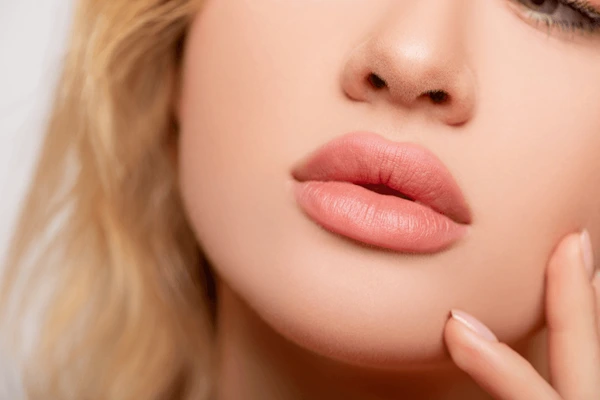 Close-up of beautifully enhanced lips, showcasing the treatment area for Restylane Kysse lip filler for natural volume and shape