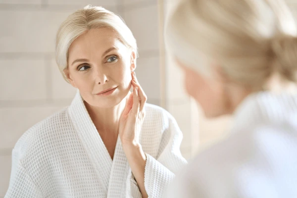 Middle-aged woman assessing suitability for Vivace treatment for skin tightening and rejuvenation