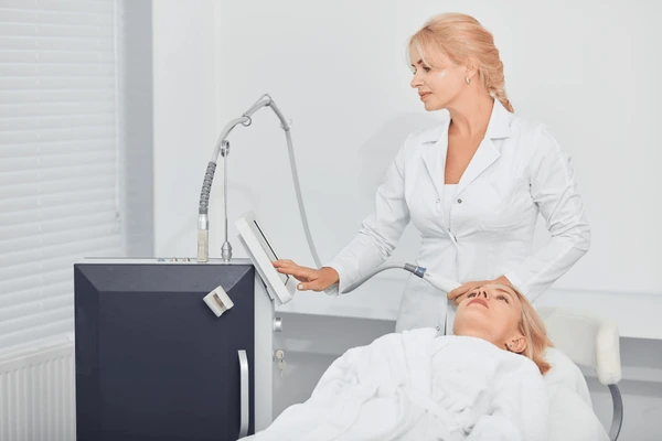 Doctor preparing equipment before Vivace treatment for non-invasive skin tightening and rejuvenation